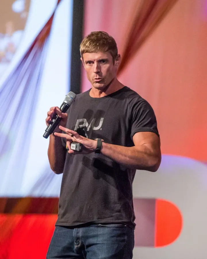 Dai Manuel speaking to a conference audience